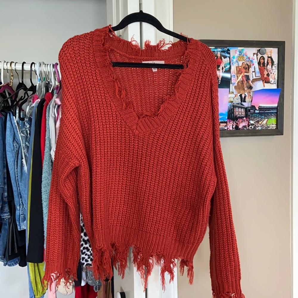 Red fringed sweater